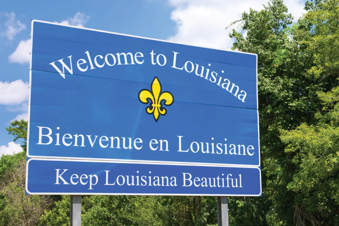 welcome to Louisiana sign on a bright sunny day